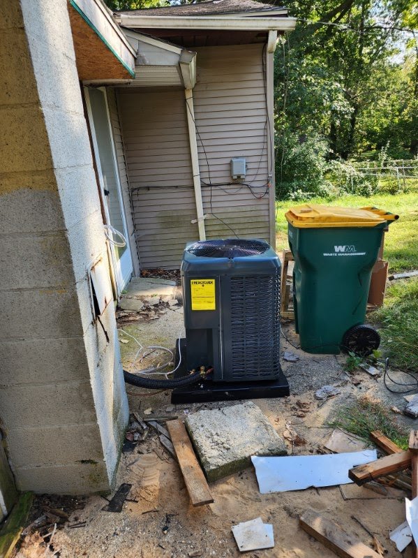 Condenser installation beside a home